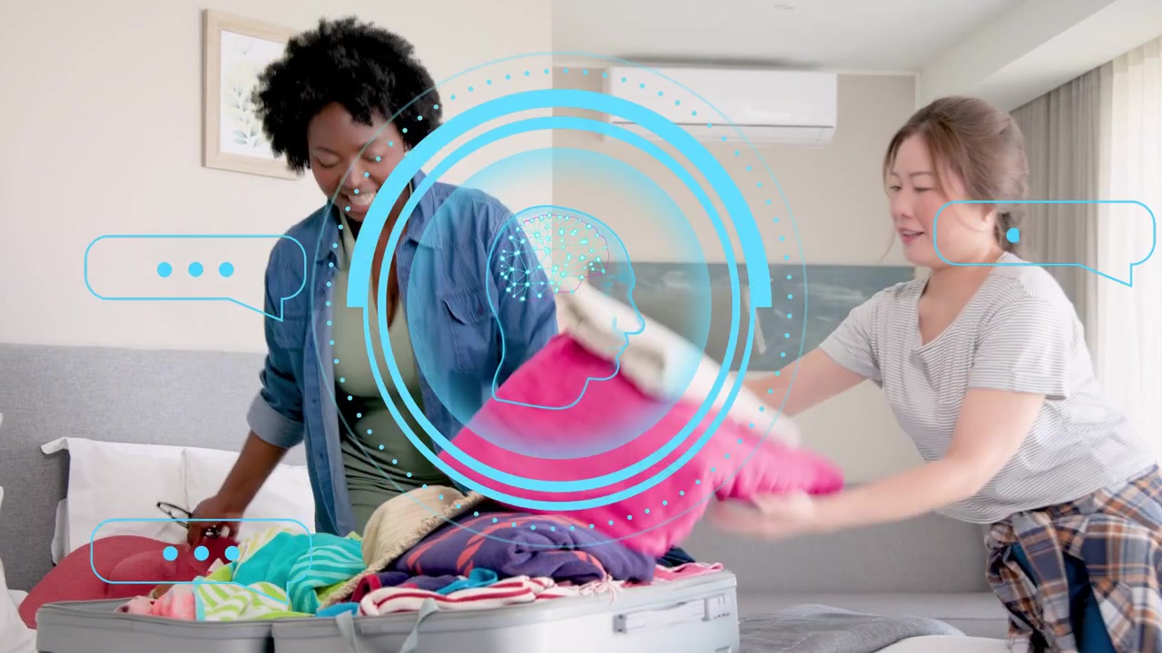 Smartphone tap initiating two women packing suitcase on bed for travel, HUD overlaying brain icon