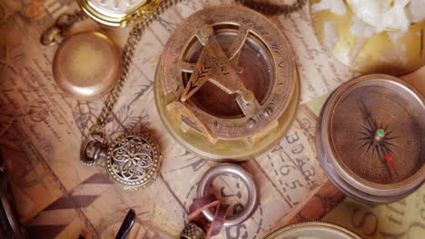 vintage style travel and adventure. vintage old compass and other vintage items on the table.