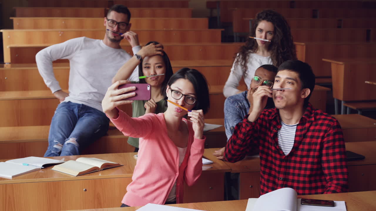 Students taking a selfie in a classroom