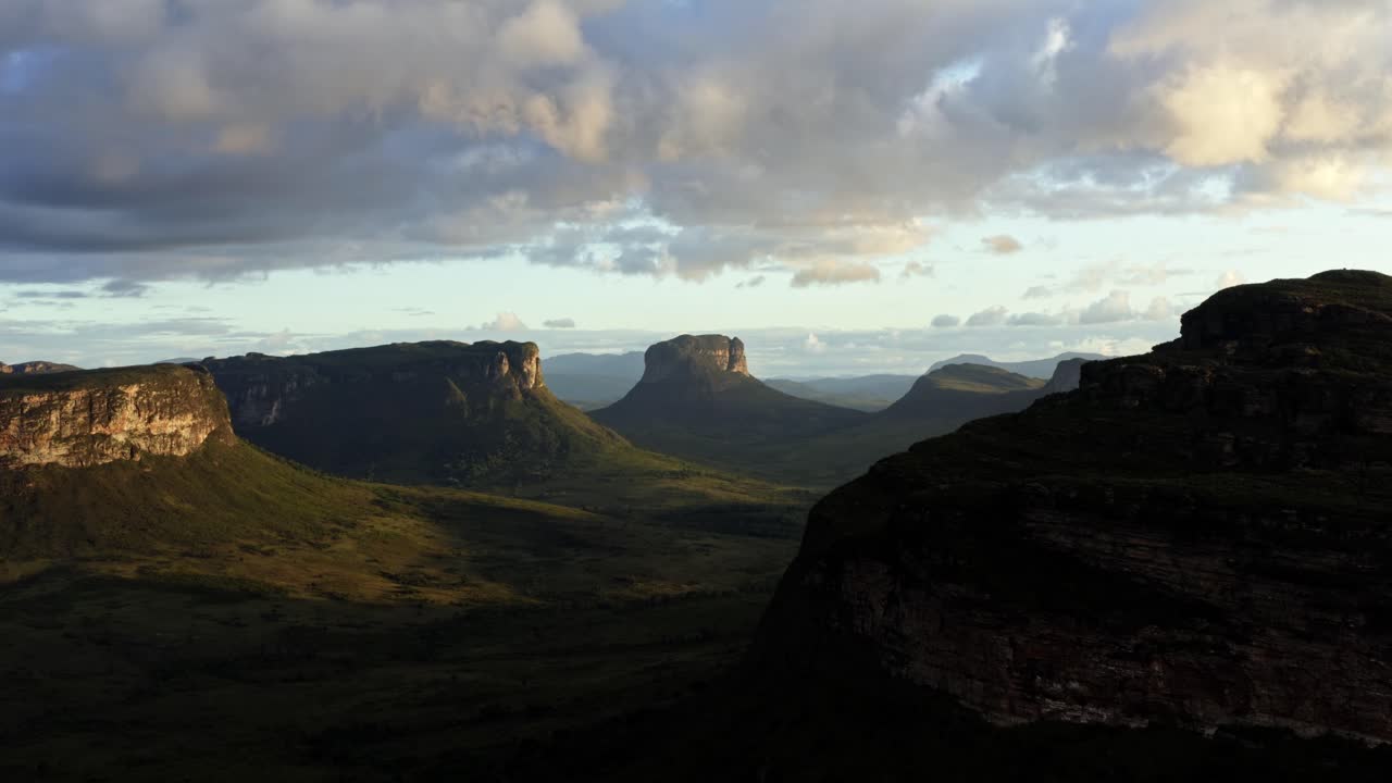 Rising flying drone landscape shot of the stunning Capao Valley from the Mount of Pai Inácio in the Chapada Diamantina national park in northern Brazil on a warm sunny summer evening