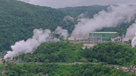 geothermal plants emit thick smoke in volcanic mountains above ormoc, leyte, showing air pollution