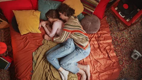 couple sleeping in a cozy retro bedroom