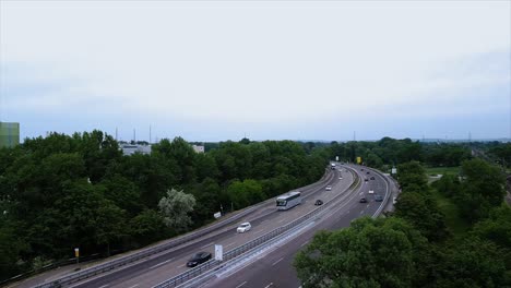 fixed drone position over important roadway while camera rotates until a beautiful bridge over the river rhine comes into view
