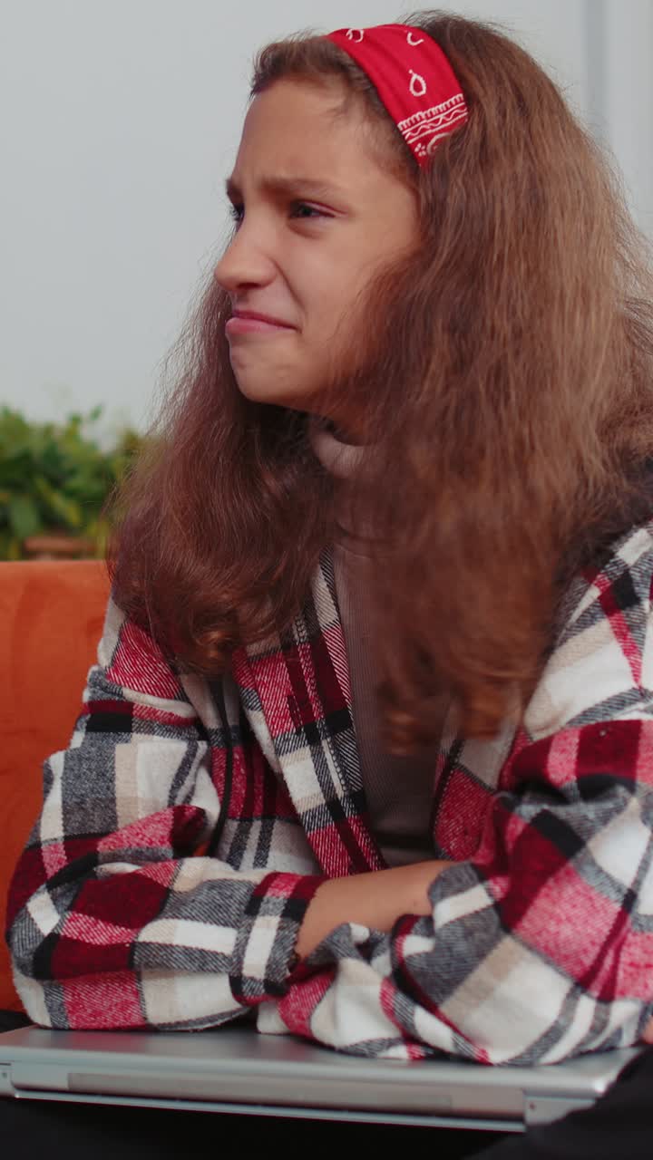 Preteen teenager girl use laptop surprised by bad news fortune loss fail lottery results at home