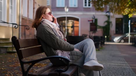 woman sitting on a bench in the city