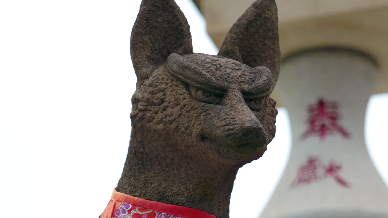 A Statue of a Fox in a Traditional Inari Shrine Japanese Temple in Tokyo, Japan