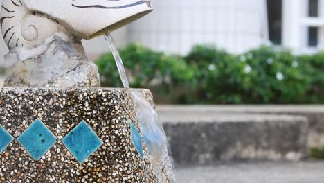 water cascading down a tiered stone fountain