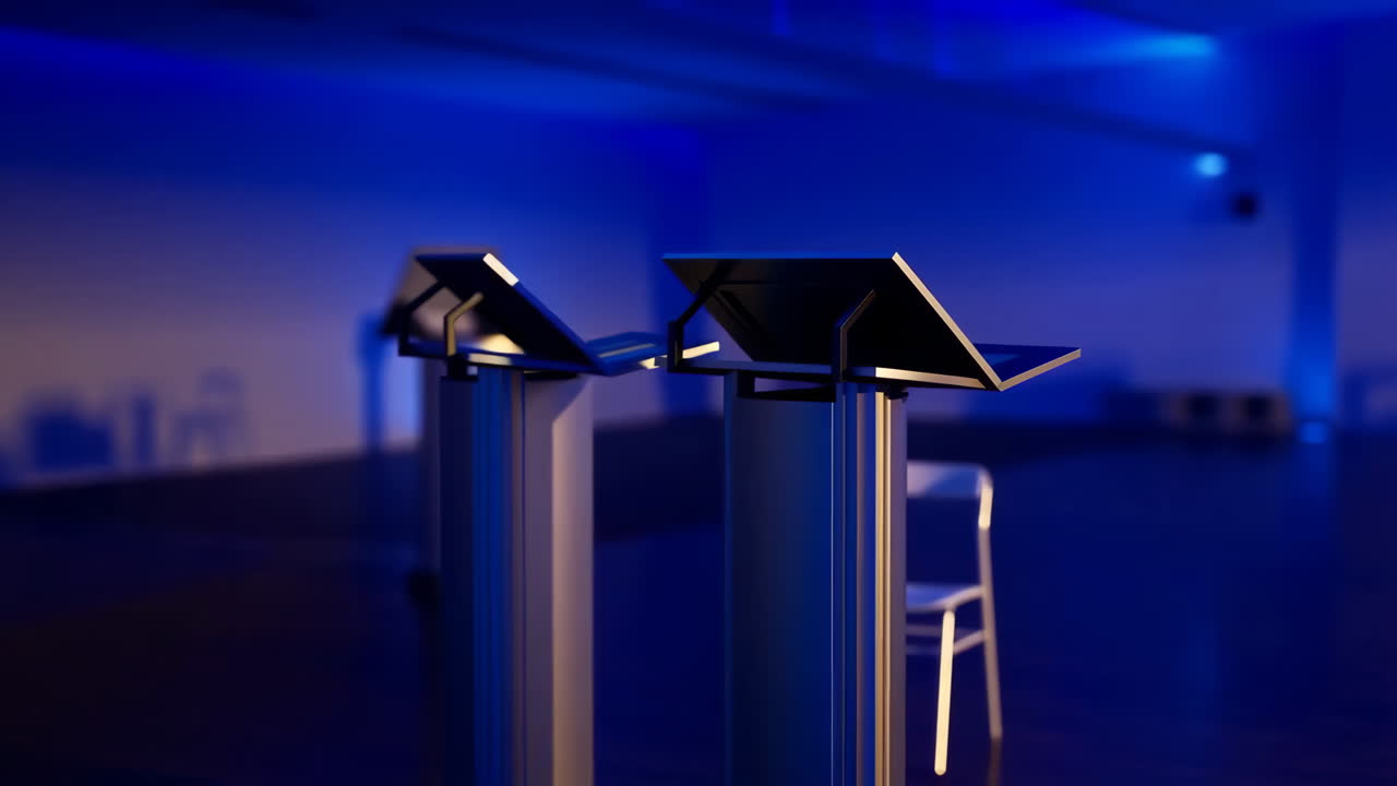 Two empty podiums under blue lighting in a dark room