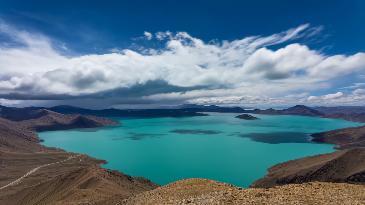 Turquoise Lake surrounded by Mountains under a Dynamic Sky