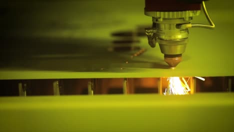 CNC-Laser-cutting-of-metal-in-slow-motion,-modern-industrial-technology.