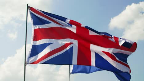 british flag and european union flag waving strongly