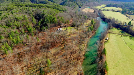 drone shot of river and valley pull out shot with mountains