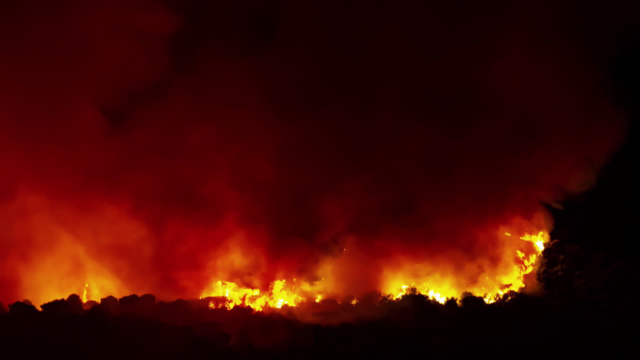 Blazing Wildfire In Forest Mountains, Flaring In Night Darkness