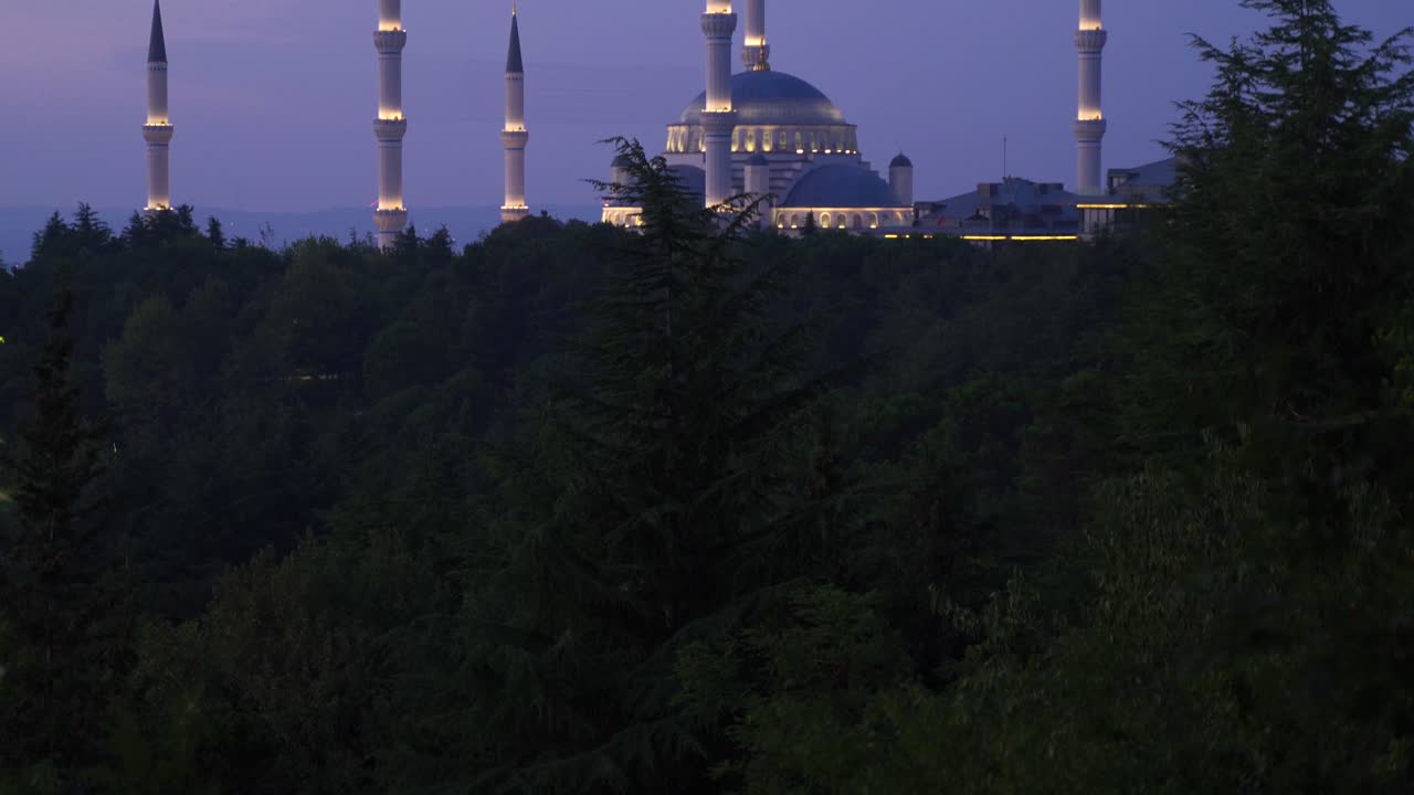 Mosque illuminated at night.