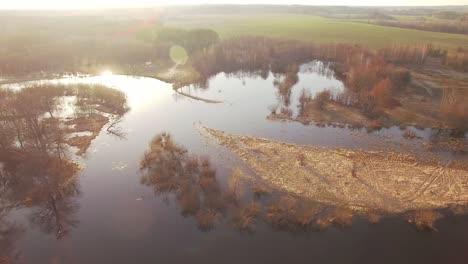 quad copter flying circling over river flood in rural area