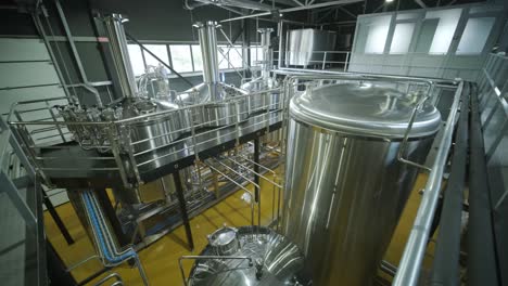 modern craft brewery. craft beer production. modern equipment in brewery, metal tanks, alcoholic drink production