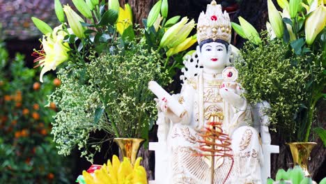 colorful offerings and statue at vietnamese temple