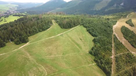 forward drone shot, with vertical panning, over a mountain valley in tatras, slovakia, europe