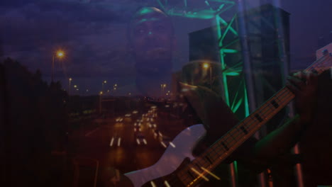 male musician playing bass guitar on stage, showing animated highway traffic and green lights