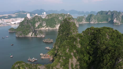 drone over epic landscape of limestone islands in ha long bay, vietnam