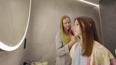 sisters getting ready in the bathroom