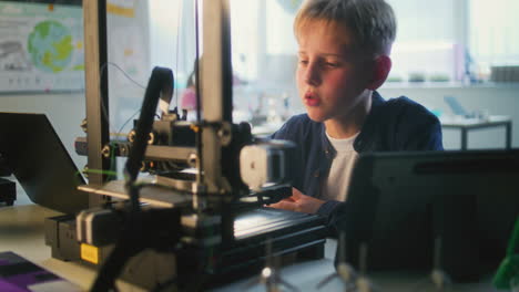 boy learning 3d printing in classroom