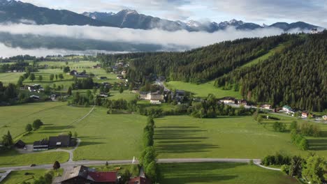 4k drone shot of beautiful misty sunrise at ramsau am dachstein, styria, austria