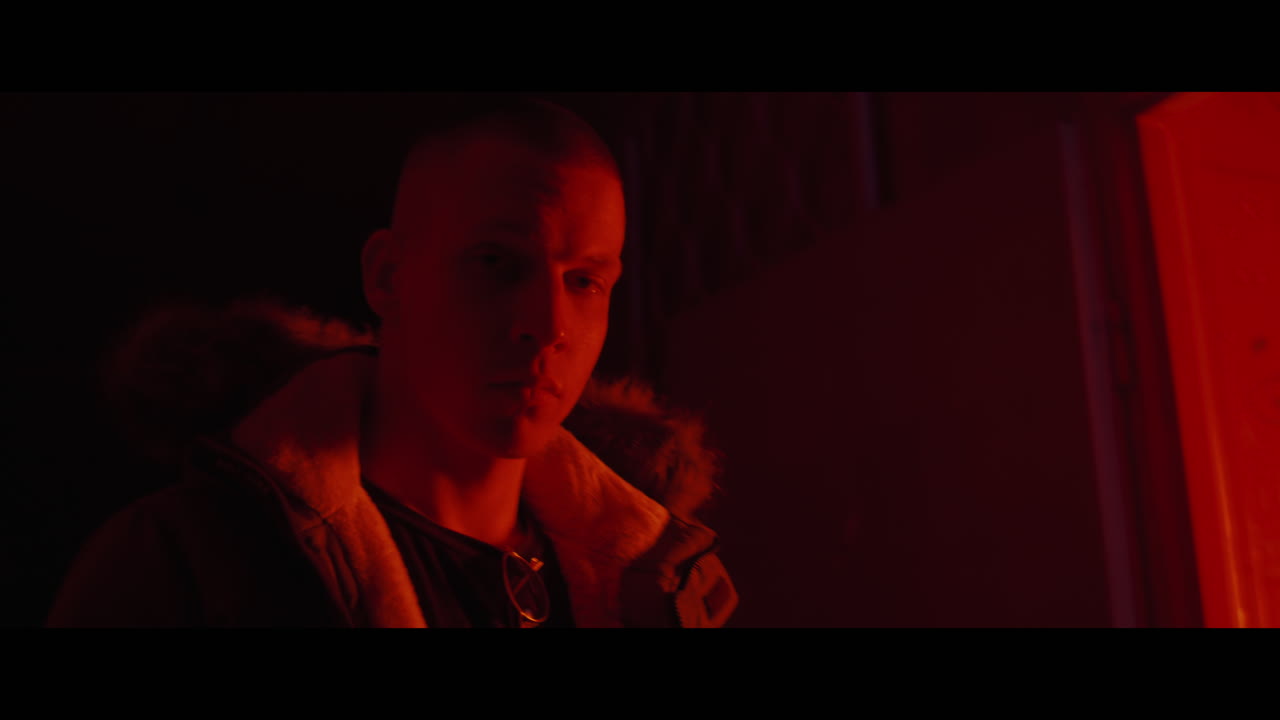 Man in a Red-lit Room