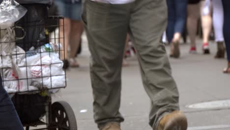 legs of people in a busy new york street