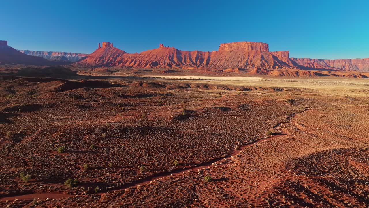 Aerial panoramic of Moab expansive desert landscape, dramatic geological formations and dry arid space