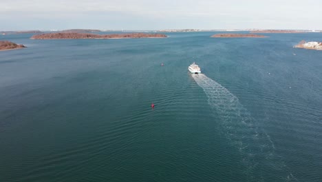 daytime drone view of the hingham mbta commuter ferry boat navigating the channel