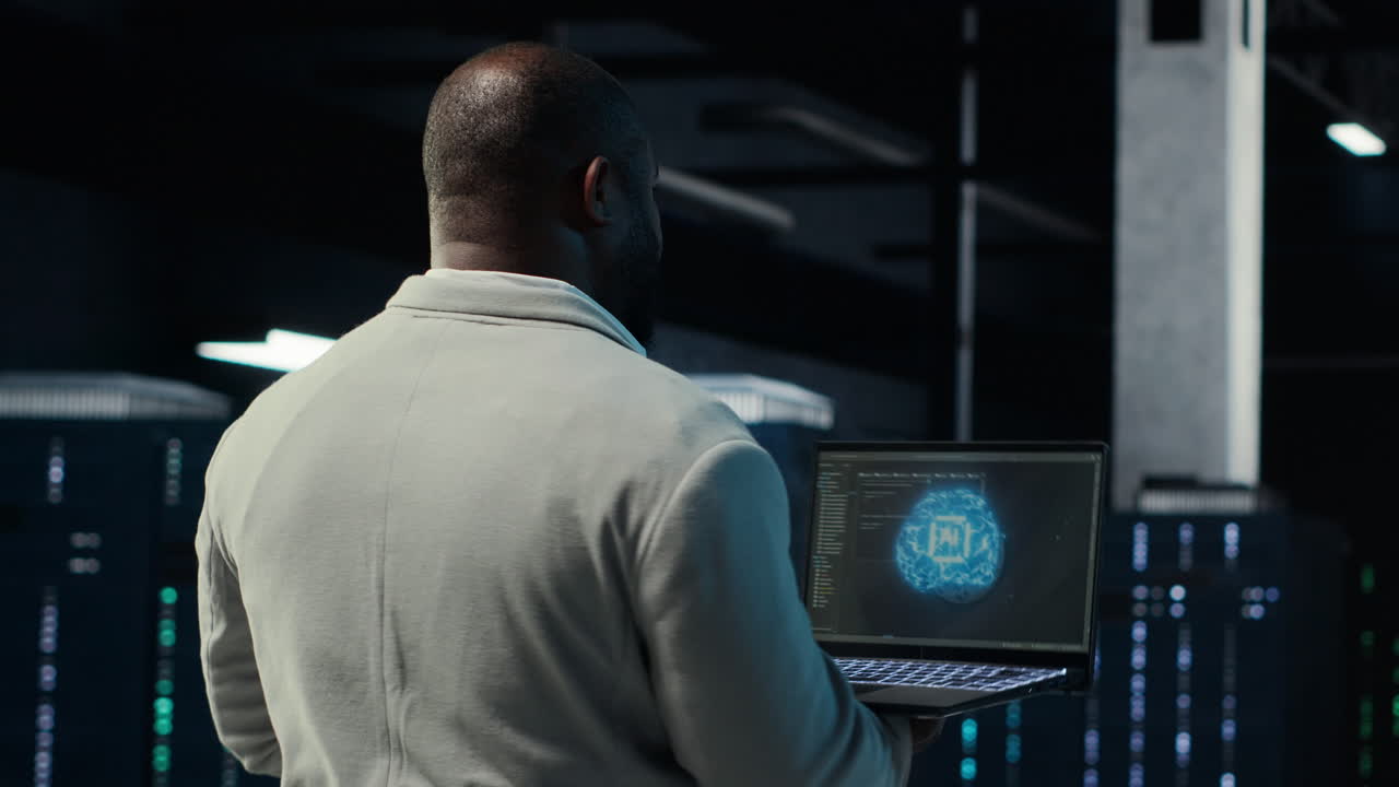 Vertical video IT expert walking in server hub using laptop to enhance AI model accuracy