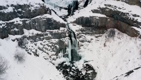 aerial drone view of the stunning frozen stewart falls waterfall near sundance ski resort in provo that requires a small hike