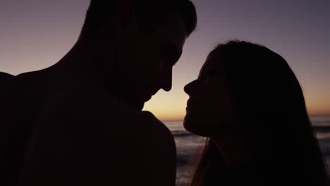 young adult couple relaxing at the seaside