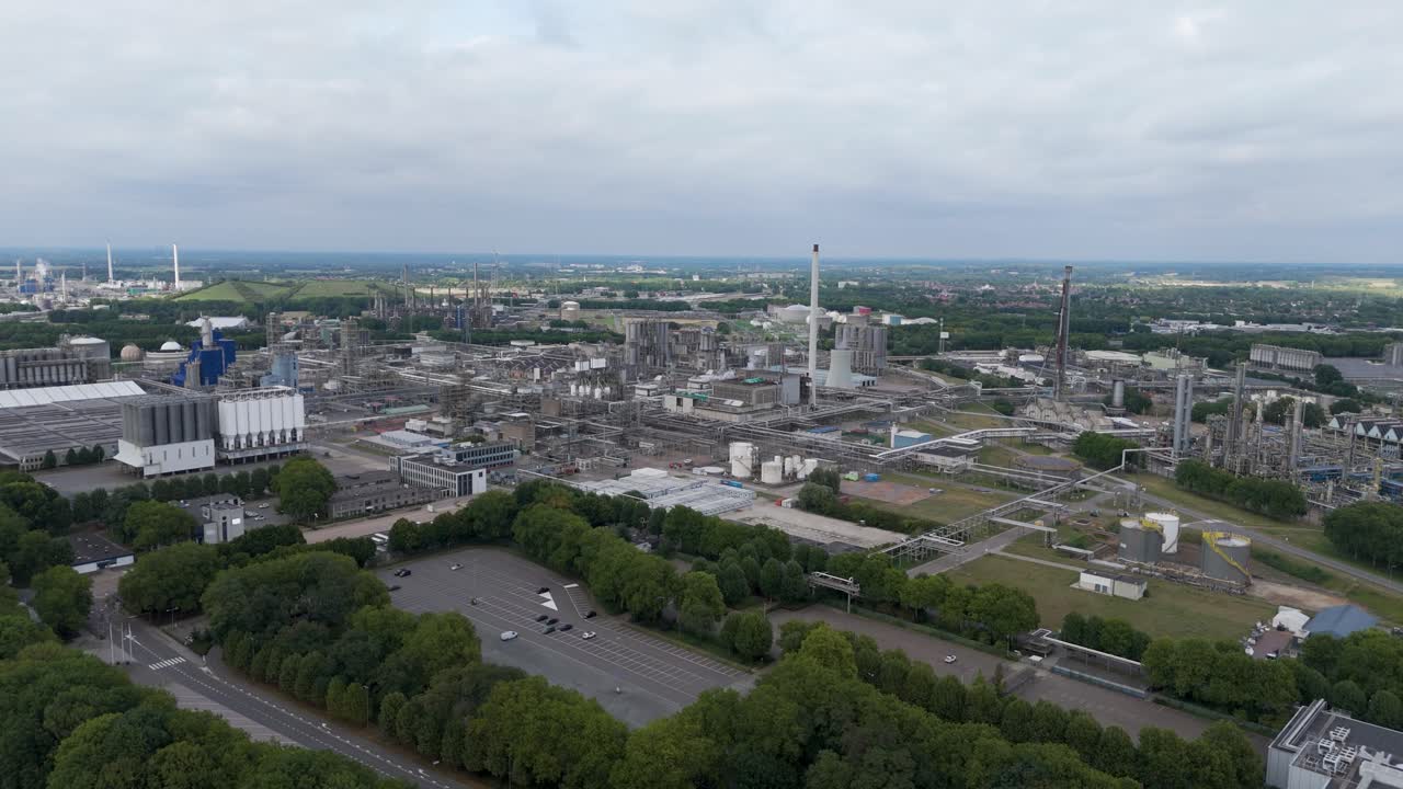 Drone footage of an industrial complex with factories, warehouses, and infrastructure, representing modern industry and production