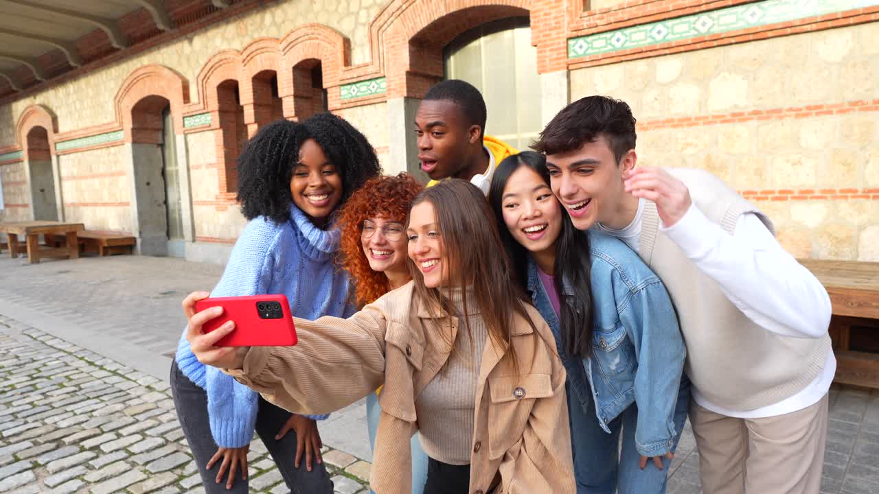 Group of young friends taking a selfie in an urban setting