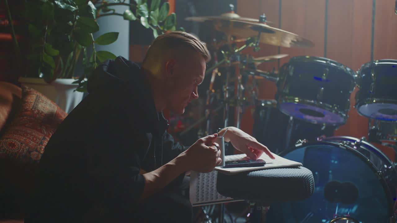 Musician Working on Music Composition in a Recording Studio