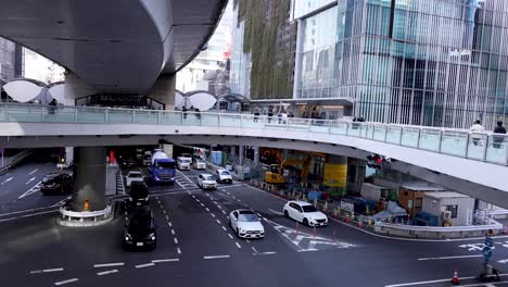 vehicles moving through a busy city intersection