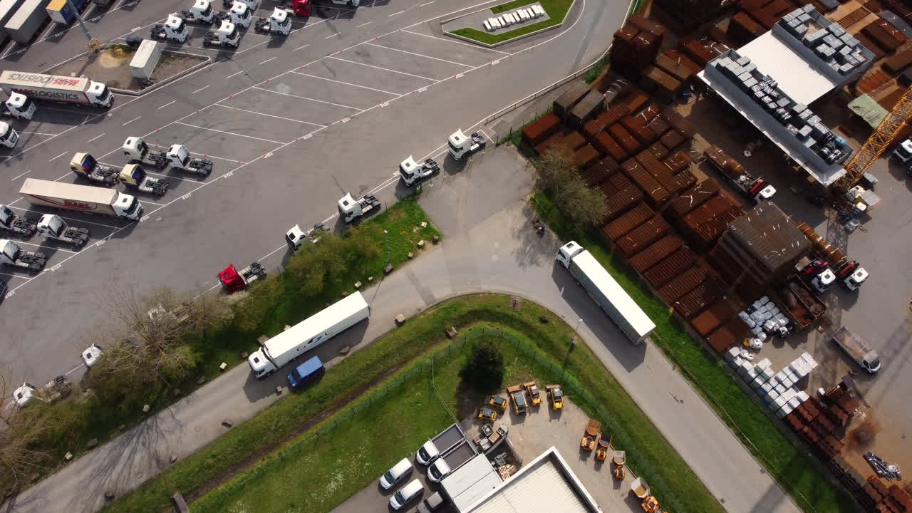 Aerial view of a busy truck stop and industrial area.