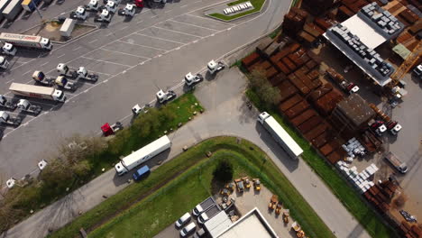 aerial view of a busy truck stop and industrial area.