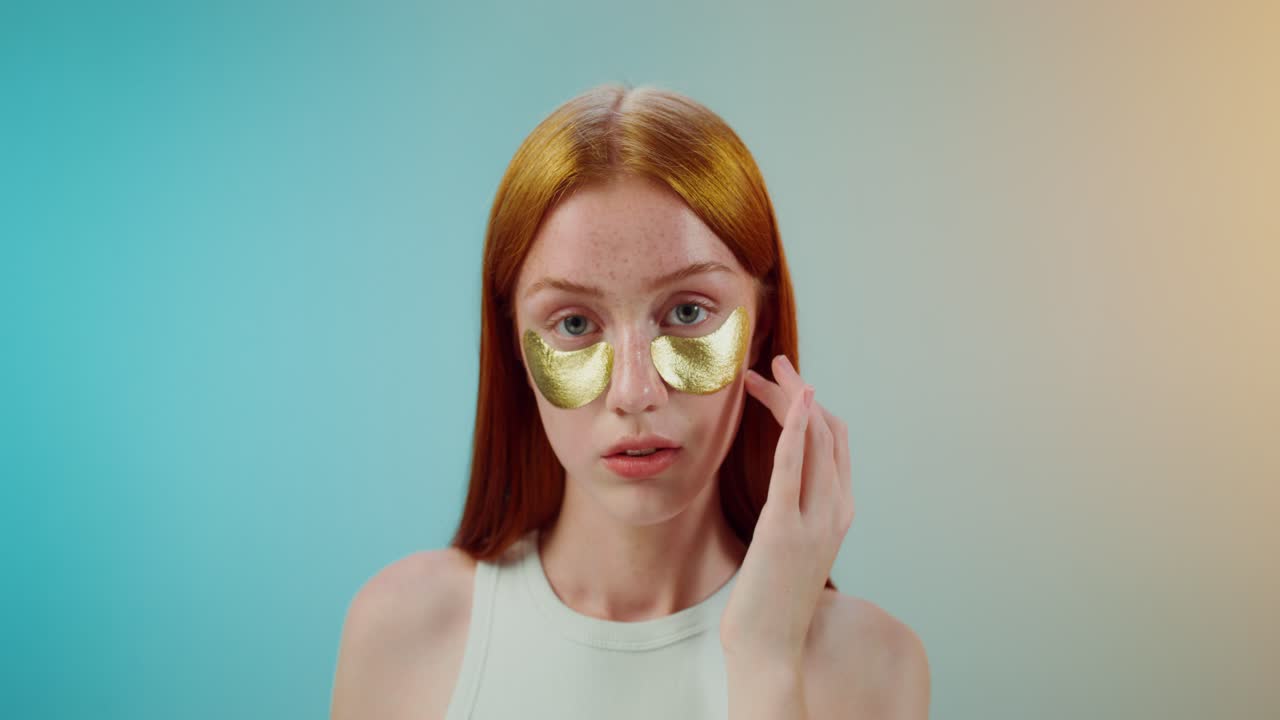 Woman with gold eye patches