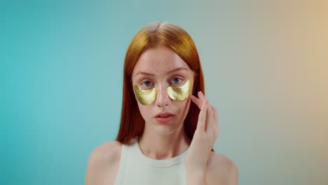 woman with gold eye patches