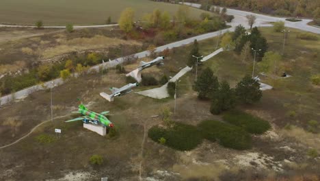 Aerial-panning-footage-of-military-airplanes-outdoor-museum-exhibition