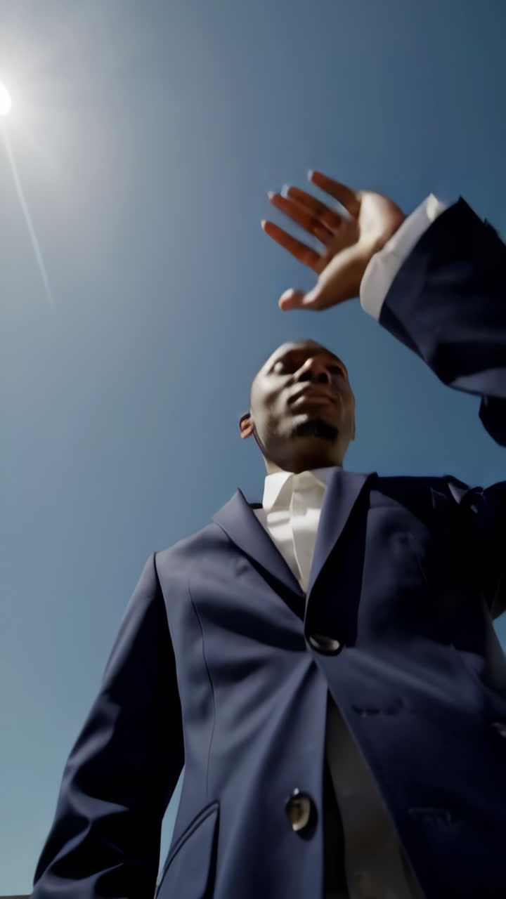 Man in a Suit Looking Up at the Sky
