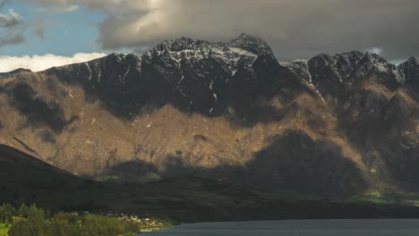 Shadow-clouds-rolling-over-The-Remarkables-Queenstown-in-New-Zealand,-Timelapse