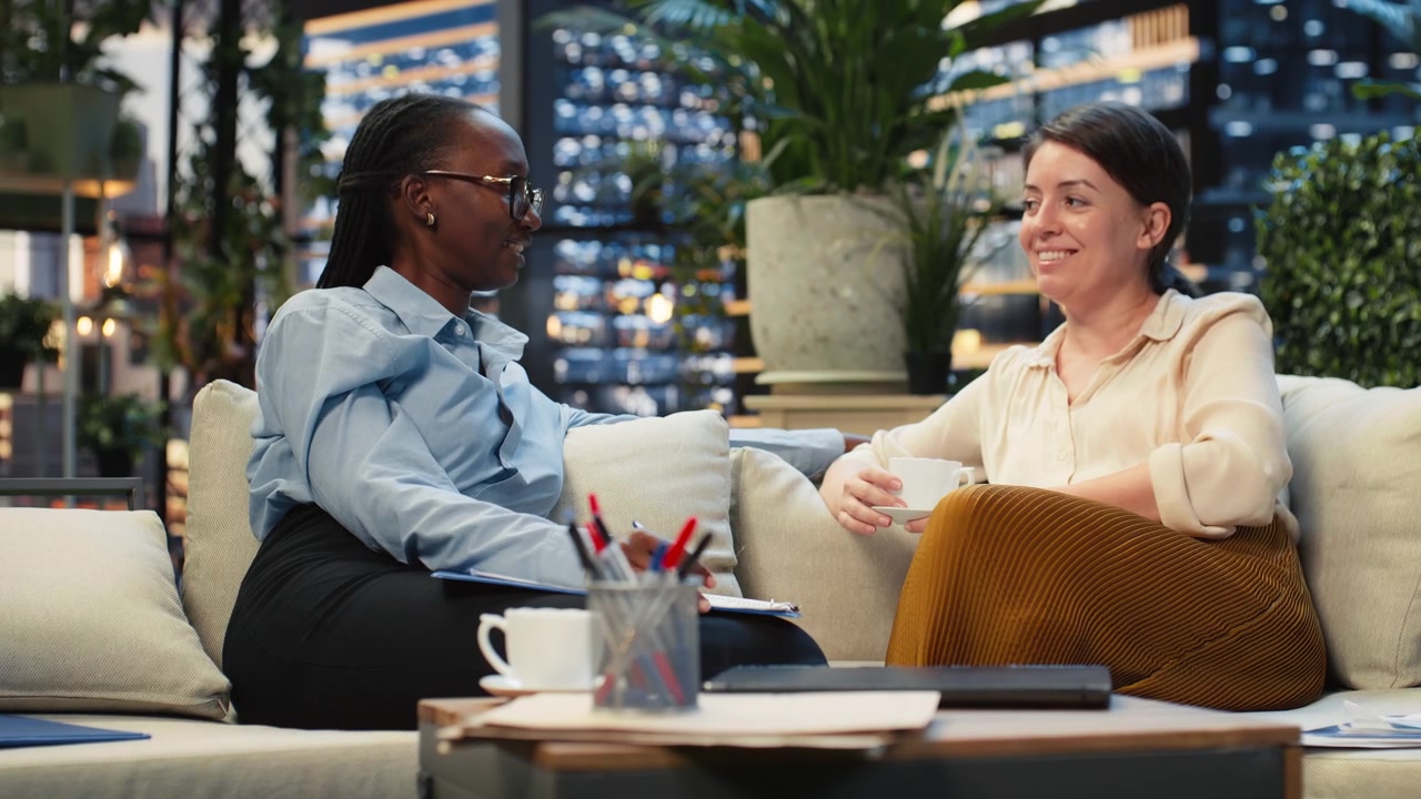 Coworkers discuss project ideas during rooftop workspace break