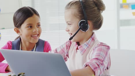 Girls-as-executives-discussing-over-the-laptop-in-office-4K-4k