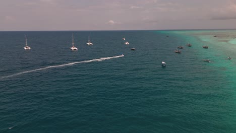 Charter Boats At The Beachfront Resort In Nungwi, Zanzibar, Tanzania, East Africa. Aerial Drone Shot