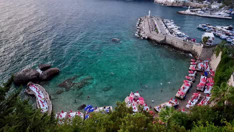 immerse yourself in the lively atmosphere of antalya, turkey's picturesque seaside promenade, where the city's charming architecture, bustling harbor, and stunning natural surroundings converge