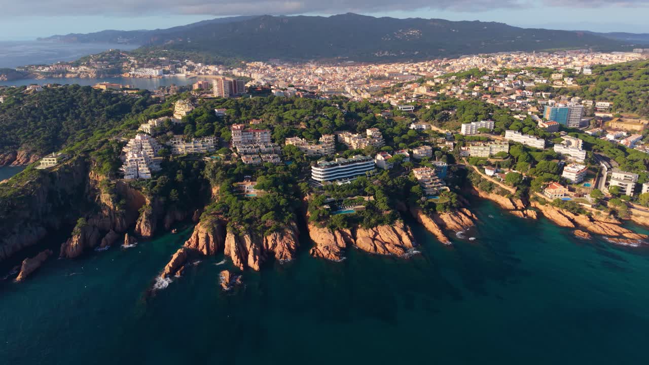 Stunning aerial perspective showing the rocky coastline and beautiful architecture of sant feliu de guixols, a charming seaside town located on the mediterranean coast of spain's costa brava